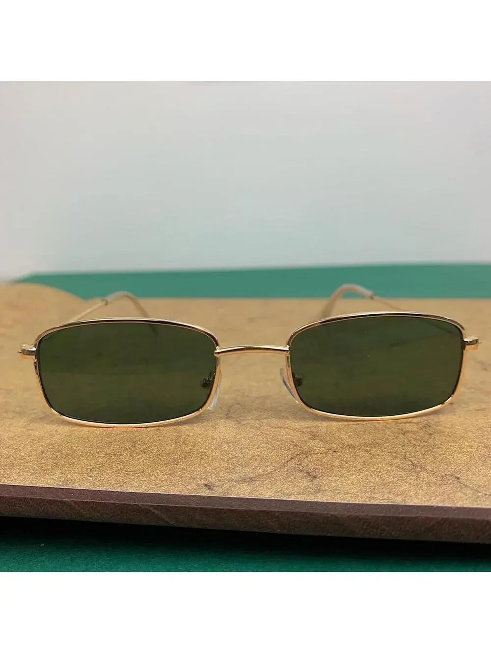 Y2k 2000s vintage green and gold unique slim style sunglasses. Gold trim with gr